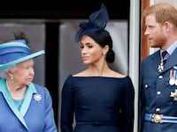 Queen Elizabeth II, Meghan, Duchess of Sussex and Prince Harry, Duke of Sussex watch a flypast to mark the centenary of the Royal Air Force from the balcony of Buckingham Palace on July 10, 2018 in London, England.
