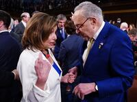 Senate Minority Leader Chuck Schumer chats with former House Speaker Nancy Pelosi on the House floor.
