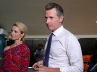 Governor of U.S. state of California Gavin Newsom and his wife Jennifer Siebel Newsom visit the premises of a migrant assistance office in San Salvador.