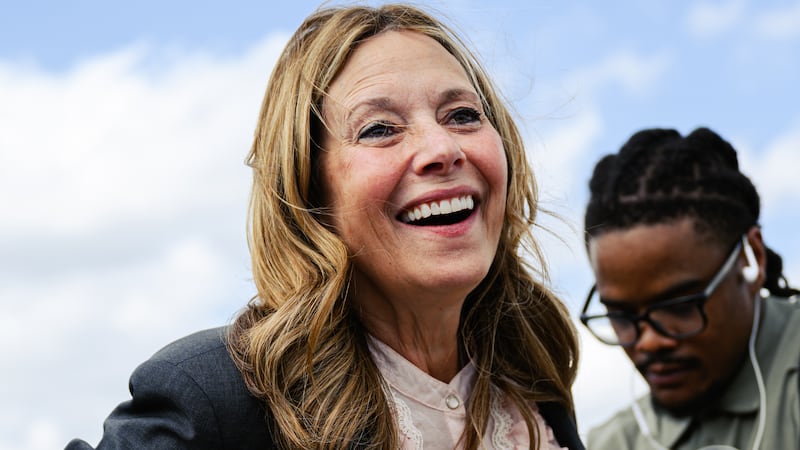 Dr. Amy Acton, Ohio Democratic gubernatorial candidate and former director of the Ohio Department of Health, is fitted with a microphone during a rally on April 28, 2026 in Cincinnati, Ohio.