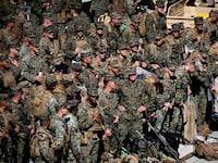 U.S. Marines with the 31st Marine Expeditionary Unit embark aboard the forward-deployed amphibious assault carrier USS Tripoli (LHA 7), at White Beach Naval Facility in Okinawa, Japan, Nov. 30, 2025.