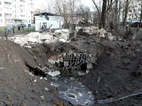 A shell crater formed at the site of falling fragments of a Russian rocket in Sviatoshynskyi district of Kyiv