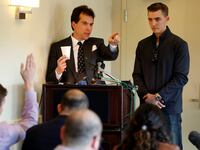 Jack Burkman, a lawyer and Republican operative, and Jacob Wohl (R), an internet activist and supporter of U.S. President Donald Trump, speak during a news conference on November 1, 2018.