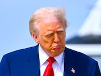 Donald Trump walks to board Air Force One at Joint Base Andrews in Maryland on April 3, 2025.