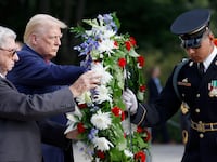 Former U.S. President Donald Trump stands during a wreath laying ceremony at Arlington National Cemetery on Aug. 26, 2024.