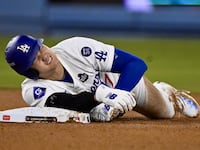 Los Angeles, CA - October 26: Shohei Ohtani (17) of the Los Angeles Dodgers reacts after being injured on the play and would leave the game after being tagged out at second base against the New York Yankees in the seventh inning during Game 2 of a World Series baseball game at Dodger Stadium on Saturday, October 26, 2024.