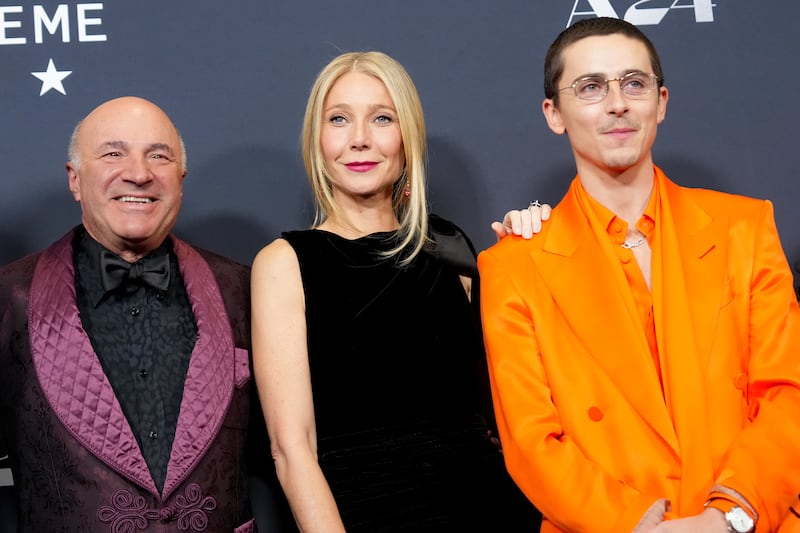 Kevin O'Leary, Gwyneth Paltrow and Timothée Chalamet at A24's "Marty Supreme" New York Premiere on December 16, 2025 in New York, New York.