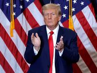 Donald Trump claps in Iowa.