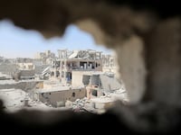 2017-08-19T170437Z_147460201_RC1956CC45D0_RTRMADP_3_MIDEAST-CRISIS-SYRIA-RAQQA_tbqaro