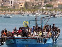 articles/2014/09/07/are-european-rescuers-enticing-migrants-to-their-deaths/140907-nadeau-migrants-tease_dg3rov