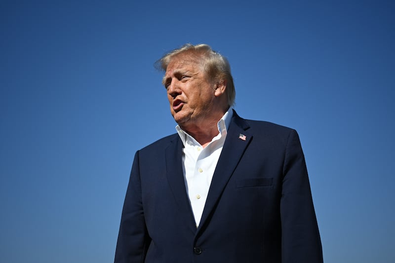 President Donald Trump showed up without a tie as he spoke with reporters before boarding Air Force One at Joint Base Andrews, Maryland on October 27, 2026.