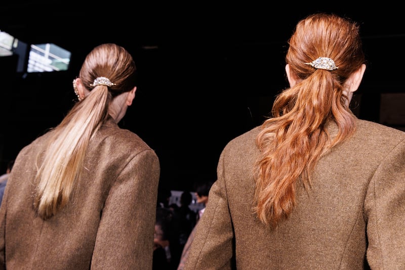 MILAN, ITALY - FEBRUARY 28: Models pose, hair detail, backstage at the Ermanno Scervino fashion show during the Milan Fashion Week - Womenswear Fall/Winter 2026/2027 on February 28, 2026 in Milan, Italy. (Photo by Rosdiana Ciaravolo/Getty Images)