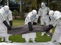 Kenya Red Cross personnel in Personal Protective Equipment (PPE) simulate the evacuation of remains of an Ebola victim in the Kenyan capital Nairobi on October 22, 2026. Kenyan authorities detected a ninth case of Ebola in the country, the health ministry said Tuesday, with a first case reported on October 6 -- a businessman in his forties who had lived in the Democratic Republic of Congo (DRC), where there has been a major outbreak since May. Since the first, eight additional cases have emerged, mostly people with a close connection to the first victim, who died in the capital Nairobi on October 5. (Photo by Tony KARUMBA / AFP via Getty Images)