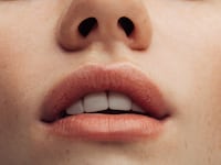 a woman's lips with lip balm