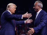 Donald Trump is greeted by Robert F. Kennedy Jr.