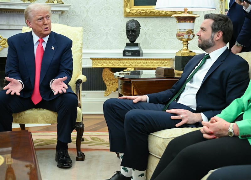 US President Donald Trump speaks to reporters as he meets with Irish Prime Minister Micheal Martin in the Oval Office of the White House in Washington, DC, on March 12, 2025. Looking on from the couch, L-R, are US Vice President JD Vance and White House Chief of Staff Susie Wiles. (Photo by Mandel NGAN / AFP) (Photo by MANDEL NGAN/AFP via Getty Images)