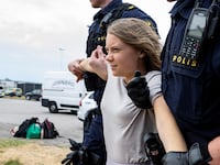 Police remove Greta Thunberg as they move climate activists from the organization Ta Tillbaka Framtiden, who are blocking the entrance to Oljehamnen in Malmo, Sweden, June 19, 2023.