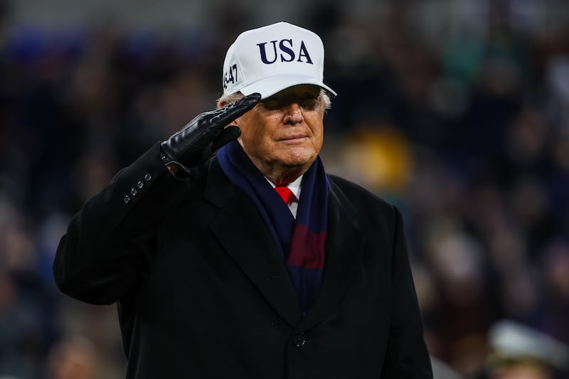 President Donald Trump salutes during halftime of the 126th Army-Navy Game between the Navy Midshipmen and the Army Black Knights at M&T Bank Stadium on December 13, 2025 in Baltimore, Maryland.