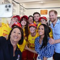 Meghan, Duchess of Sussex and Prince Harry, Duke of Sussex pose for a selfie photo as they meet volunteer first responders from Bondi Surf Bathers' Life Saving Club, during a visit to Bondi Beach, on day four of the royal trip to Australia on April 17, 2026 in Sydney, Australia. Volunteers from the organization, founded in 1907, played an integral role in protecting beachgoers and saving lives during the terrorist attack at Bondi Beach on December 14.