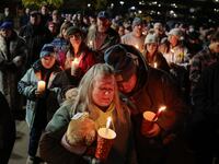 A crowd gathers for a vigil honoring the victims of the Lewiston shootings, in Auburn Maine on Nov. 2, 2023.