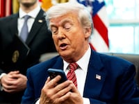 WASHINGTON, DC May 23, 2025:
US President Donald Trump silenced his cellphone in the Oval Office of the White House on Friday May 23, 2025. The executive orders were related to the nuclear power industry in the US.
(Photo by Demetrius Freeman/The Washington Post via Getty Images)