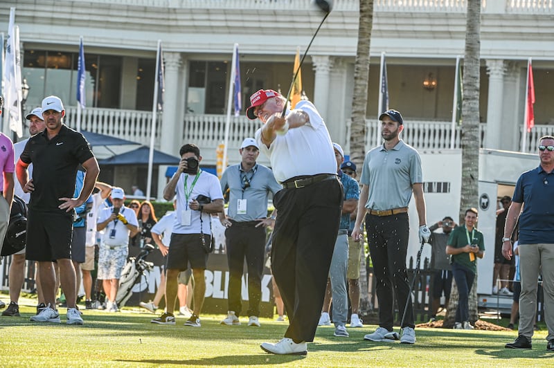 Donald Trump tees off during a visit a day ahead of the 2022 LIV Golf Invitational Miami at Trump National Doral Miami golf club on October 27, 2022 in Miami, Florida.