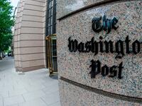 The Washington Post logo on a building.