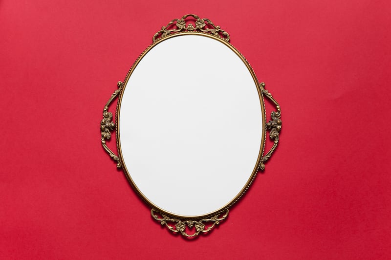Horizontal composition with a baroque frame on a red background