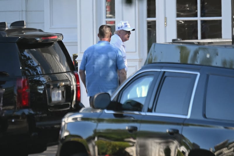 US President Donald Trump exits his vehicle as he arrives at Trump National Golf Club in Sterling, Virginia on August 10, 2025.