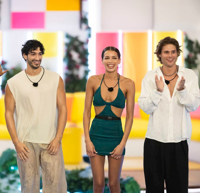 Zacharias Georgiou, Kayda Reese Bosse, and Bryce Alakai Dettloff stand side by side in a photo from a scene in Love Island season Eight's week one episode.