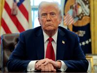 U.S. President Donald Trump talks to reporters.