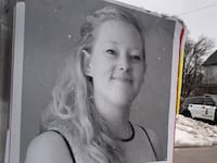 MINNEAPOLIS, MINNESOTA - JANUARY 16: A poster featuring Renee Good sits along the street near a memorial to Good on January 16, 2026 in Minneapolis, Minnesota. Protests have sparked up around the city after a federal agent fatally shot Good in her car during an incident in south Minneapolis on January 7. (Photo by Scott Olson/Getty Images)