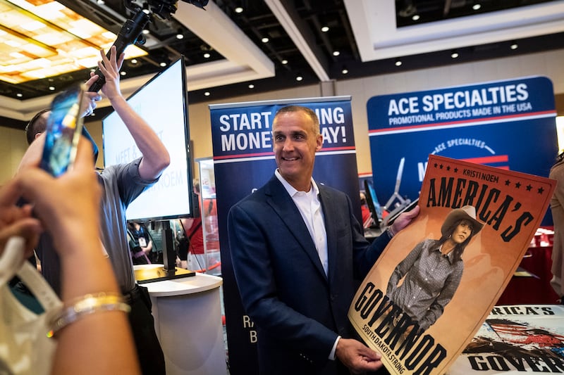 ORLANDO, FL - FEBRUARY 27: Corey R. Lewandowski holds a poster for South Dakota Gov. Kristi Noem during the Conservative Political Action Conference CPAC held at the Hyatt Regency Orlando on Saturday, Feb 27, 2021 in Orlando, FL.
