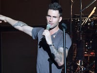 INDIANAPOLIS, IN - AUGUST 18: Lead Vocalist, Adam Levine and Drummer, Matt Flynn of Maroon 5 perform onstage at Conceso Fieldhouse on August 18, 2011 in Indianapolis, Indiana. (Photo by Joey Foley/Getty Images)