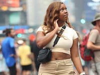 Carlee Russell walks through Times Square, New York.