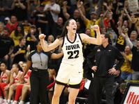 Guard Caitlin Clark #22 of the Iowa Hawkeyes celebrates after breaking Pete Maravich's all-time NCAA scoring record