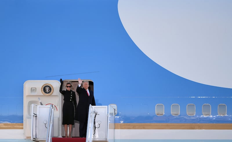 President Donald Trump and Melania Trump wave as they board Air Force One at Joint Base Andrews in Suitland, Marland on January 20, 2021.