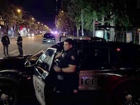 This image grab from an AFPTV footage shows Police officers operating at the site where a car ploughed into a street party in Vancouver on April 26, 2025. Vancouver police said they did not suspect "an act of terrorism" after a driver plowed into a street party on April 26, 2025 in the Canadian city, killing a number of people. (Photo by AFPTV teams / AFP) (Photo by AFPTV TEAMS/AFP via Getty Images)