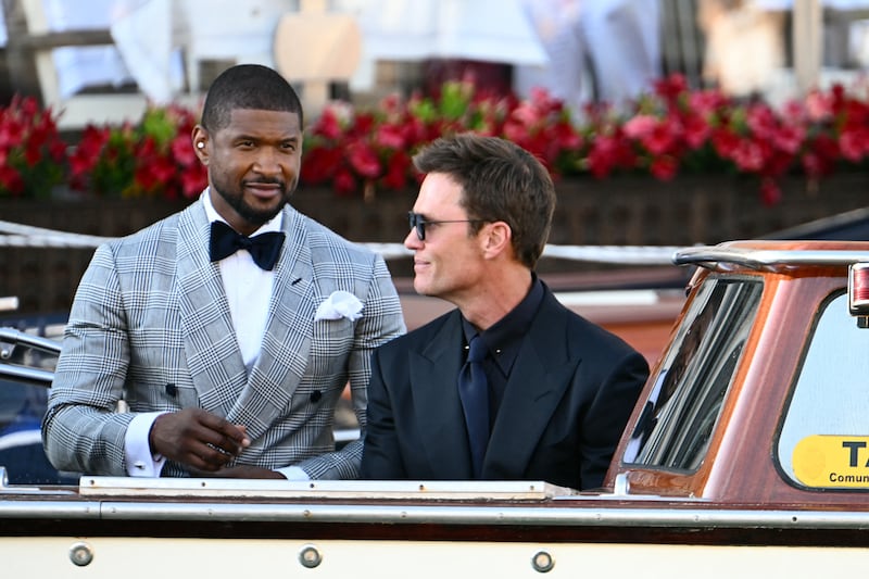 Usher and Tom Brady were photographed as they left the Gritti Palace Hotel on Friday.