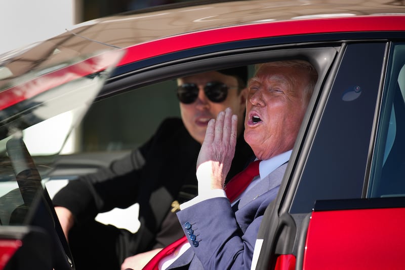 U.S. President Donald Trump and White House Senior Advisor, Tesla and SpaceX CEO Elon Musk sit in a Tesla Model S on the South Lawn of the White House on March 11, 2025 in Washington, DC.