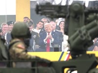 President Donald Trump along with other guests watch as members of the U.S Army participate in the 250th birthday parade of the U.S. Army June 14, 2025 in Washington, D.C.