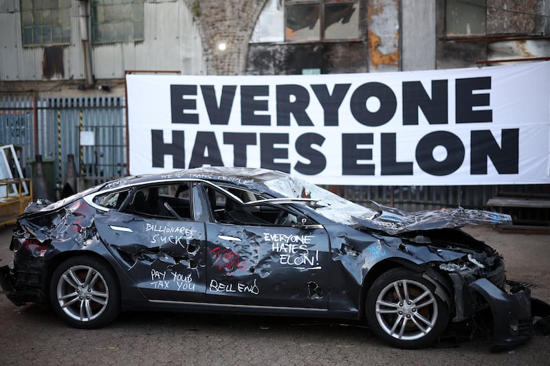 A Tesla car is pictured after being smashed-up at an anti Elon Musk protest, in south London on April 10, 2025.