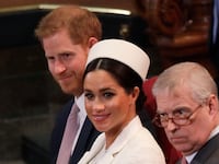 Awkward much? Meghan, Duchess of Sussex sits with Prince Harry and Prince Andrew at a 2019 church service.