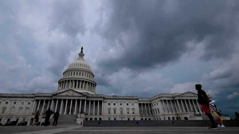 Storm clouds over the Capitol on Tuesday, shortly after the Senate passed its version of Trump's bill.