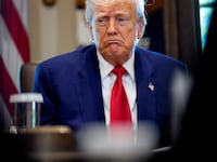 Donald Trump reacts to a question during a Cabinet meeting at the White House.