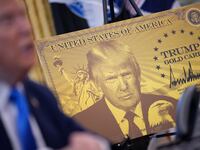 WASHINGTON, DC - SEPTEMBER 19: A poster of the “Trump Gold Card” is seen as President Donald Trump delivers remarks in the Oval Office at the White House on September 19, 2025 in Washington, DC. The “Trump Gold Card” is a visa that allows foreign nationals permanent residency and a pathway to U.S. citizenship for a $1 million investment in the United States. (Photo by Andrew Harnik/Getty Images)