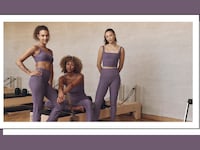 Three women wearing Beyond Yoga activewear in the gym.