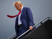 Former president Donald Trump arrives at Ronald Reagan Washington National Airport in Arlington, Va. on Thursday, August 3, 2023.