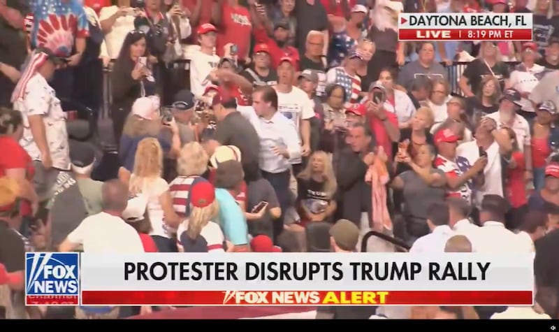 A protester is ejected from a Trump rally in Florida.