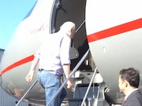 Julian Assange boarding a plane and departing the U.K. after striking a deal with U.S. prosecutors.